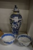 A Chinese blue and white baluster shaped vase and two tea bowls.