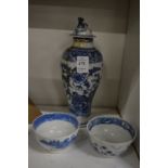 A Chinese blue and white baluster shaped vase and two tea bowls.