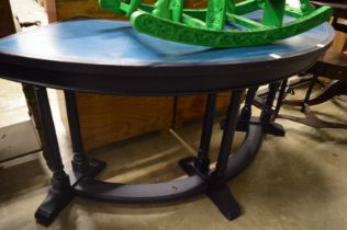 A blue leather cloth inset demi-lune oak serving table.