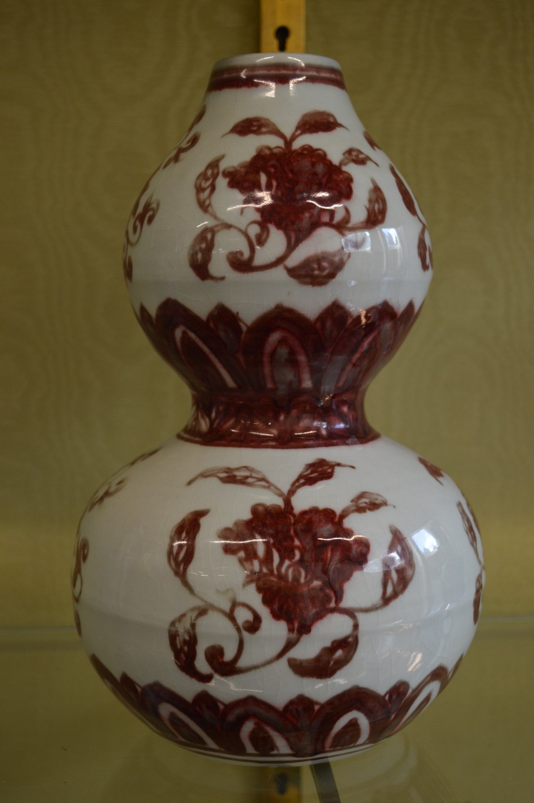 A Chinese red and white decorated double gourd shaped vase.