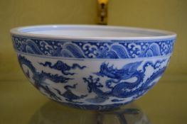 A large Chinese blue and white circular bowl.