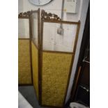 A gilt framed, glazed and upholstered folding dressing screen.