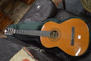 A classical guitar with case.