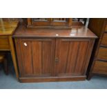 A Victorian walnut two door cupboard.