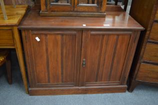 A Victorian walnut two door cupboard.