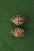 A pair of enamel decorated egg shaped pendants.