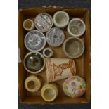 Early toothpaste pots and other items.