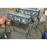 A pair of wrought iron plant troughs.