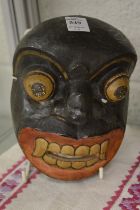 A good set of five amusing colourful African masks.