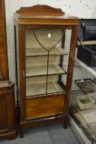 A mahogany display cabinet.