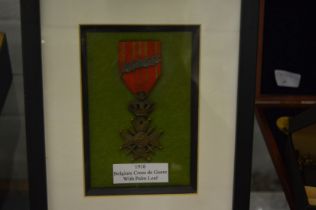 The Belgium Cross de Guere medal with palm leaf, 1918, framed and glazed and other items.