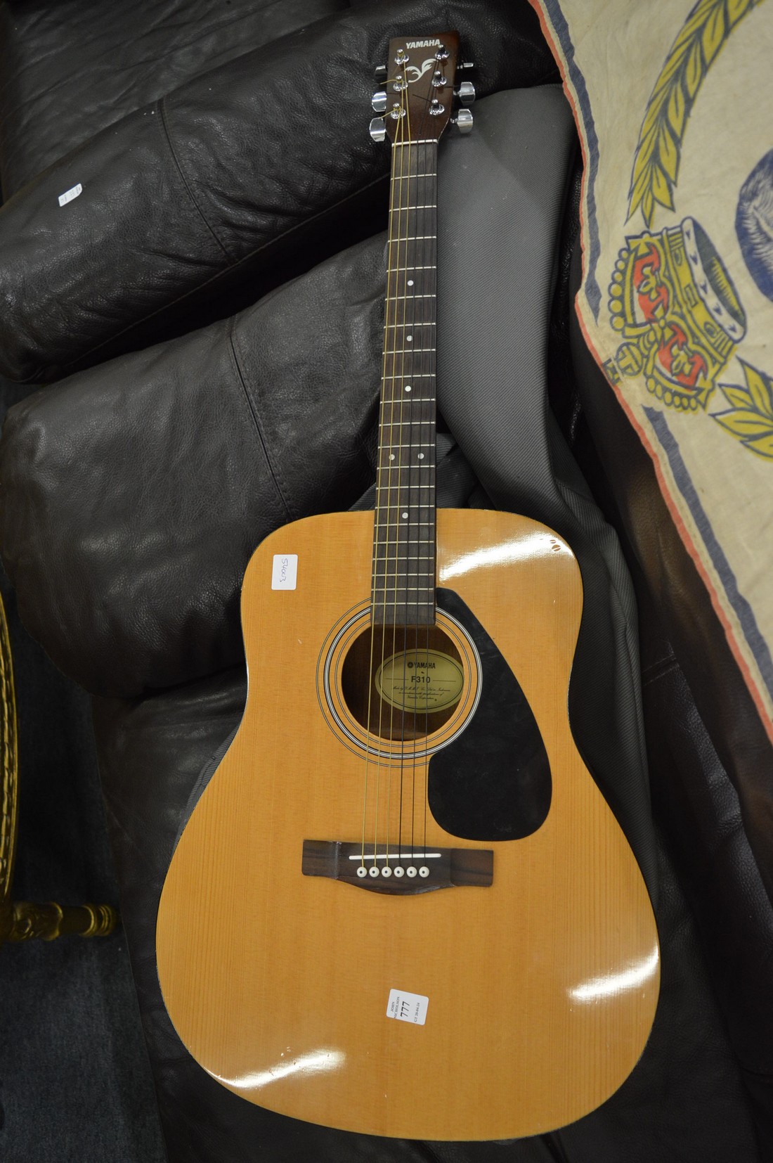 A Yamaha F310 classical guitar with case.