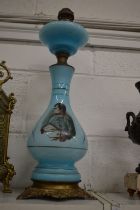 A good large pair of pale blue opaque glass and brass lamp bases decorated with Lord Nelson and Lady