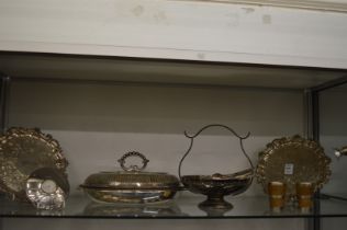 A pair of plated waiters and other items to include a entree dish.