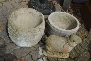 A garden ornament modelled as a sheep and two planters.