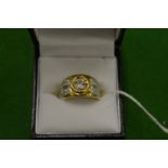 An 18ct yellow gold and diamond ring, size M½.