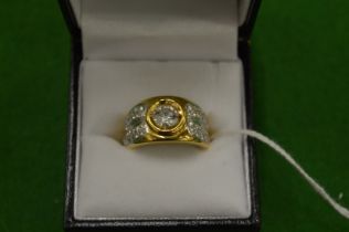 An 18ct yellow gold and diamond ring, size M½.