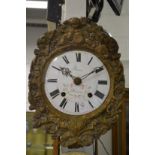 A Continental wall clock with painted enamel dial and embossed brass frame.