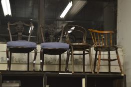 A pair of dining chairs and two others.