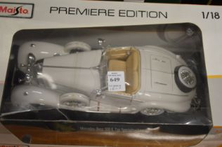 Model car, boxed and various figures.