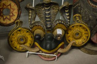 A large colourful tribal mask.