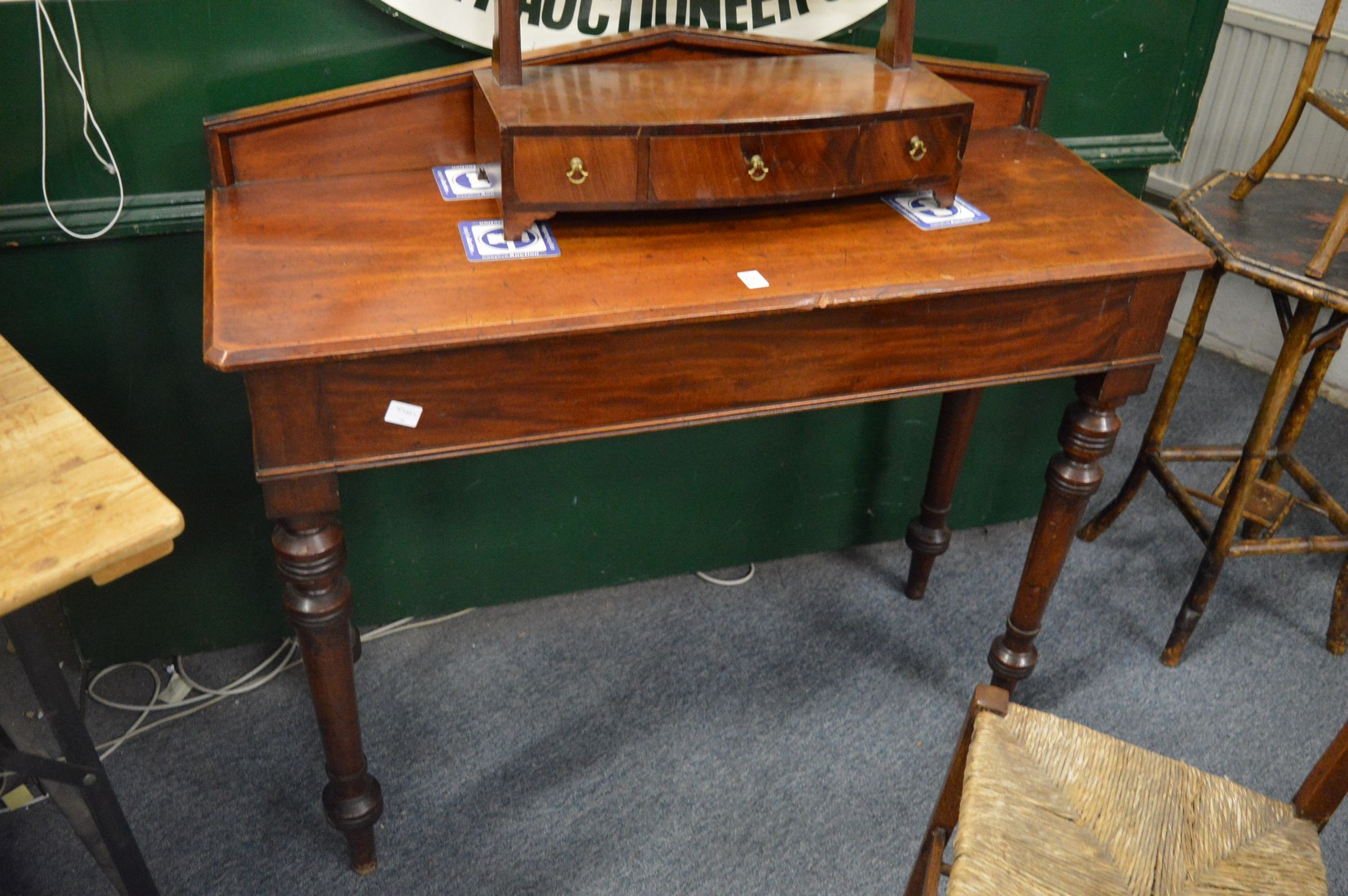 A Victorian mahogany side table with a drawer to one end.