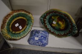Two Majolica stands and a Spode Italian pattern vegetable dish cover.