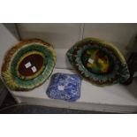 Two Majolica stands and a Spode Italian pattern vegetable dish cover.