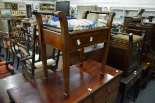 A mahogany piano stool.