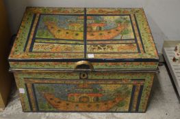 Decoratively painted tin trunk.