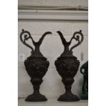 A pair of classical style spelter ewers.