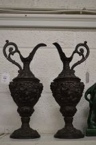 A pair of classical style spelter ewers.