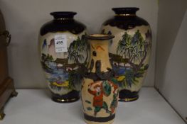 A pair of satsuma vases and a smaller satsuma vase.