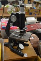 A boxed microscope.