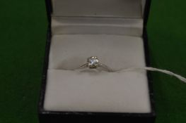 An 18ct white gold and diamond solitaire ring, size J.