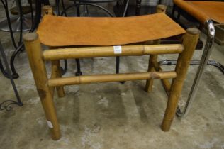 A bamboo and leather stool.