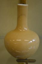 A Chinese yellow glazed bulbous shaped vase.