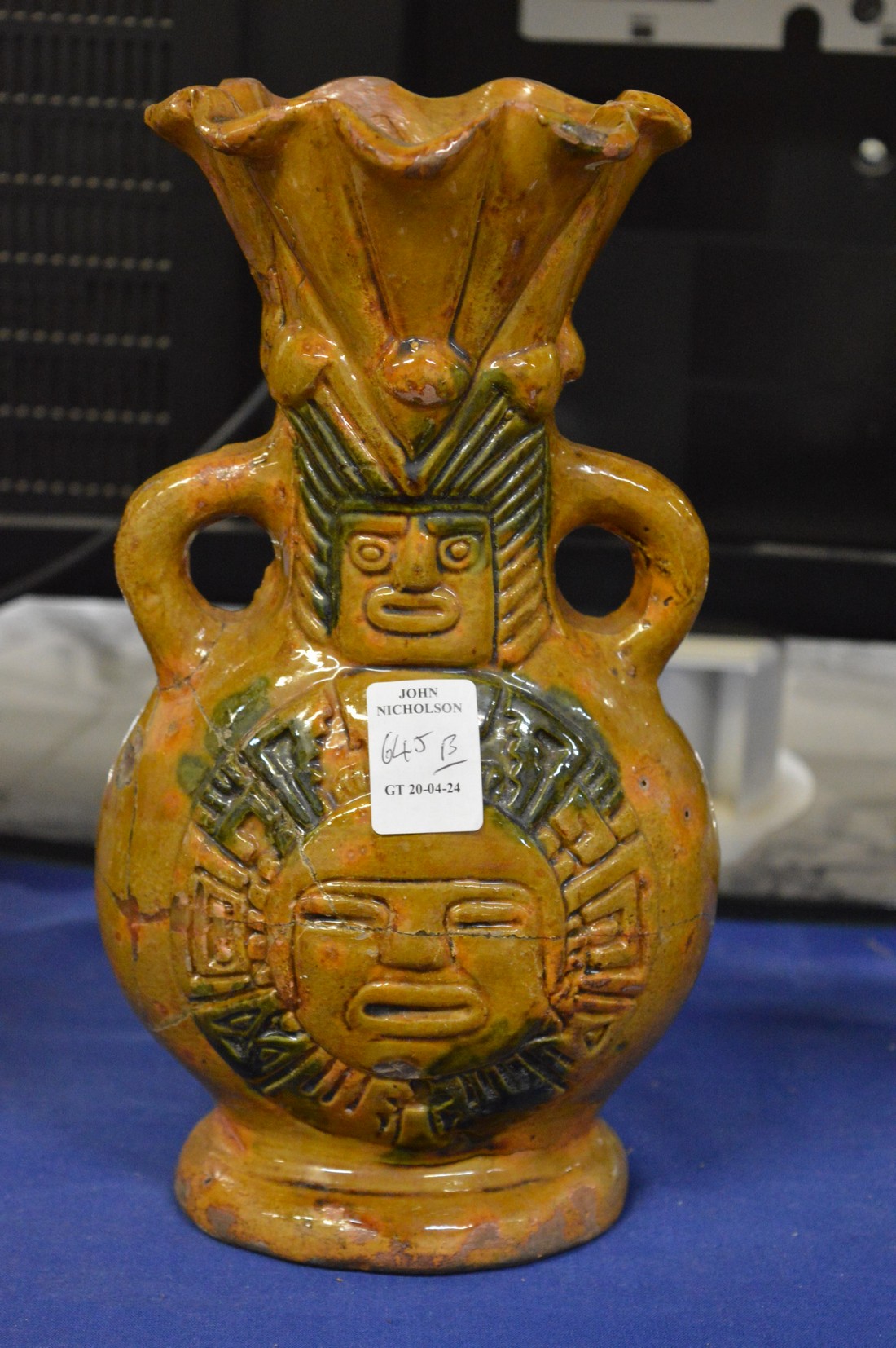 A Peruvian style twin handled figural vase.
