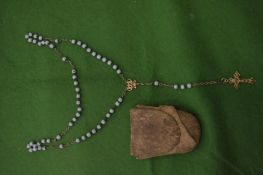 A rosary with turquoise beads.