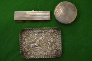 Small embossed silver dish and two other items.