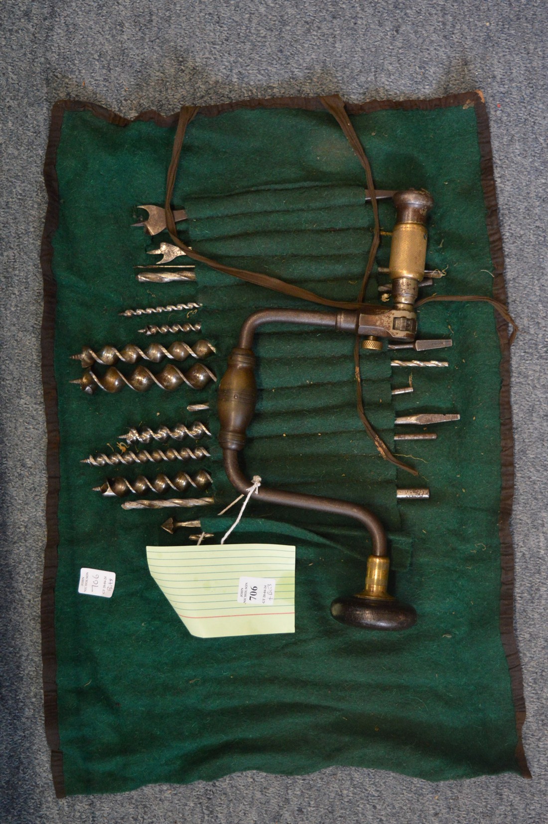 A rare antique brace by The Davis Level & Tool Company together with a collection of drill bits.