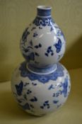A large Chinese blue and white gourd shaped vase.