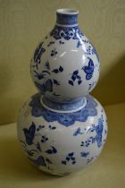 A large Chinese blue and white gourd shaped vase.