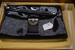 A Louis Vuitton black handbag, boxed.