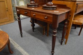 A Victorian mahogany two drawer side table.