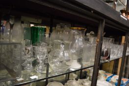 A large quantity of glassware to include numerous vases, drinking glasses etc.