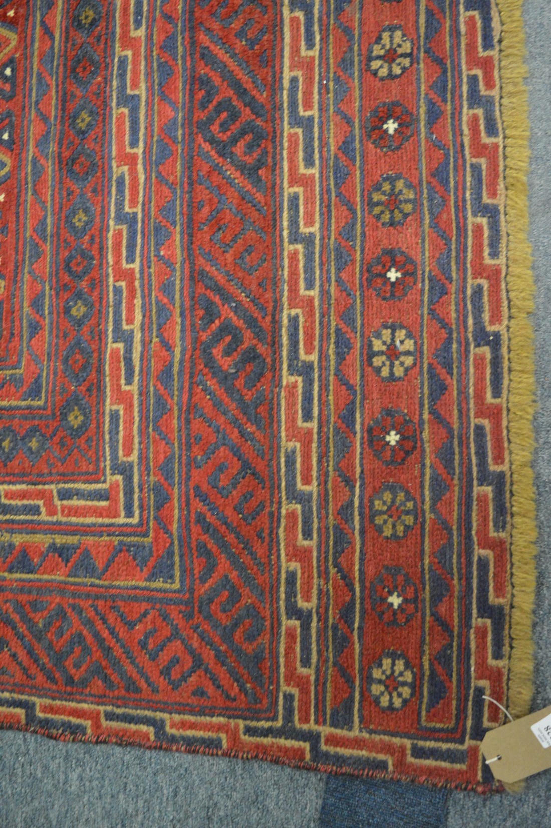 An unusual Persian style carpet, red ground with geometric decoration 182cm x 153cm. - Image 2 of 3