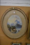 Cattle at a watering hole, mountainous landscape beyond, watercolour, framed oval.