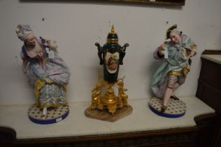 A large pair of Continental porcelain figures of a dandy and a lady (faults).
