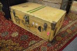 A large vellum suitcase.